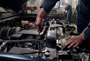 Photo of mechanic using Craftsman screwdriver CMHT65618V to work on a car engine in an auto repair shop.